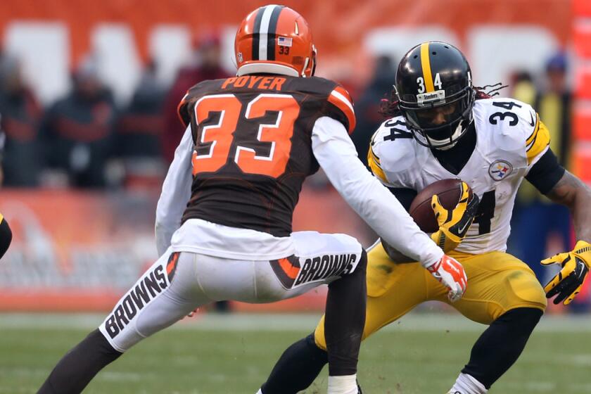 Pittsburgh Steelers running back DeAngelo Williams (34) tries to run past Cleveland Browns cornerback Jordan Poyer (33) during the first half last Sunday.