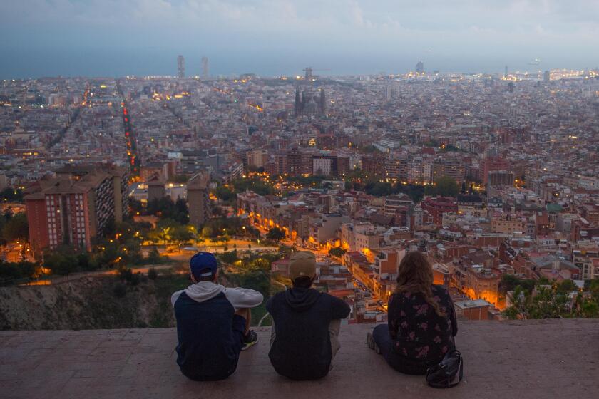 People enjoy the view over Barcelona, Spain.