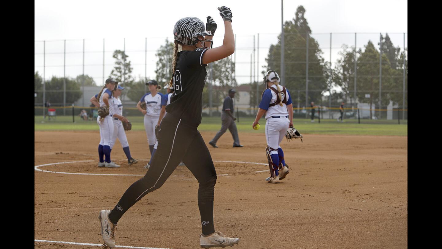 Huntington Beach Firecrackers Rico/Weil's Macy Simmons gestures to the dugout after her grand slam against the New Jersey Intensity in the PGF Nationals 18U Premier bracket at Huntington Beach Sports Complex on Wednesday, July 25.