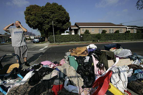 Alex Rodriguez is upset with the clothing, debris and garbage that is illegally dumped across the street from his house at Wadsworth Avenue and 107th Street in Watts. "I don't even want to have my kids out here because of the smell," says Rodriguez.