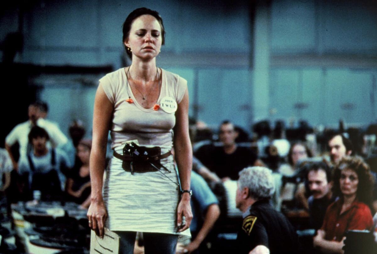 Sally Field appears in a scene from the 1979 film "Norma Rae." Field won a best actress Oscar for her role as a gritty worker who attempts to unionize a Southern textile mill.