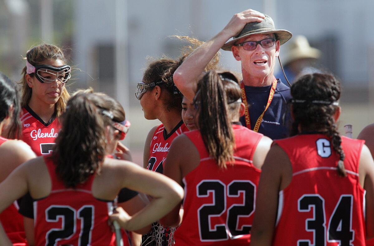 Glendale High Head Coach Joe Campbell addresses his team during a game against Crescenta Valley High in a Pacific League girls' lacrosse match on Friday, April 3, 2015.