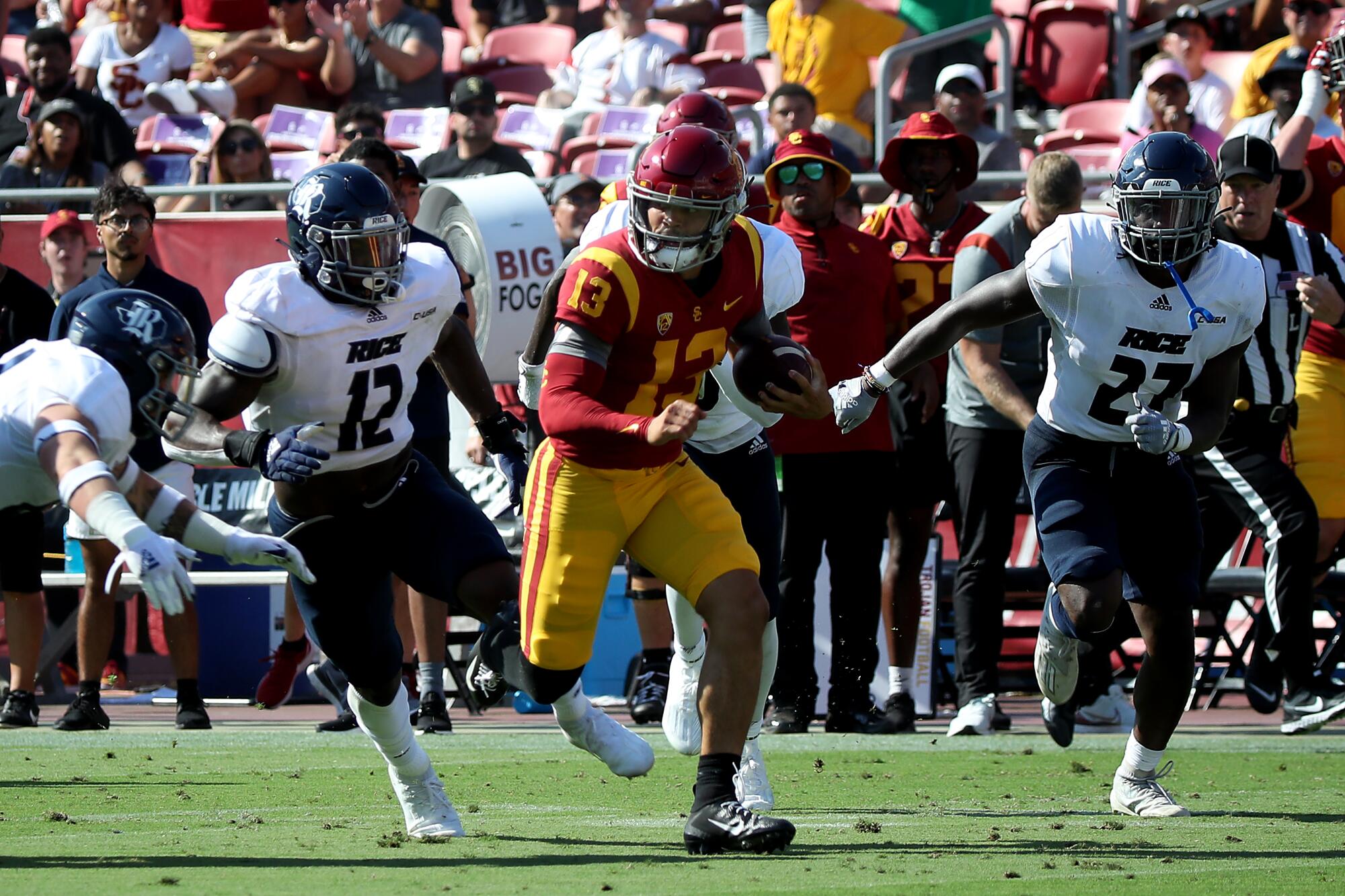 USC quarterback Caleb Williams carries the ball against Rice in the second quarter Saturday at the Coliseum.