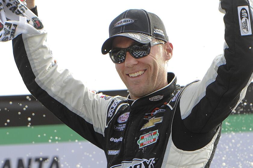 Kevin Harvick celebrates after winning Saturday's NASCAR Xfinity Series race at Atlanta Motor Speedway.