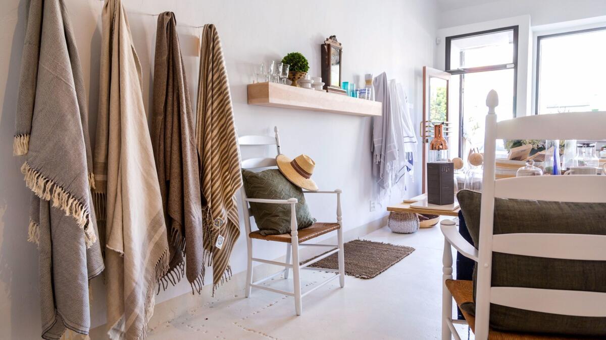 Fringed blankets hand-loomed in Mexico hang on the wall at Motti Casa on Ventura Boulevard in Studio City.