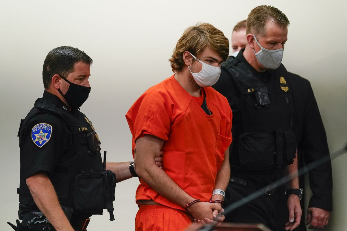 Payton Gendron is led into the courtroom for a hearing at Erie County Court, in Buffalo, N.Y., Thursday, May 19, 2022. Gendron faces charges in the May 14 fatal shooting at a supermarket. (AP Photo/Matt Rourke)