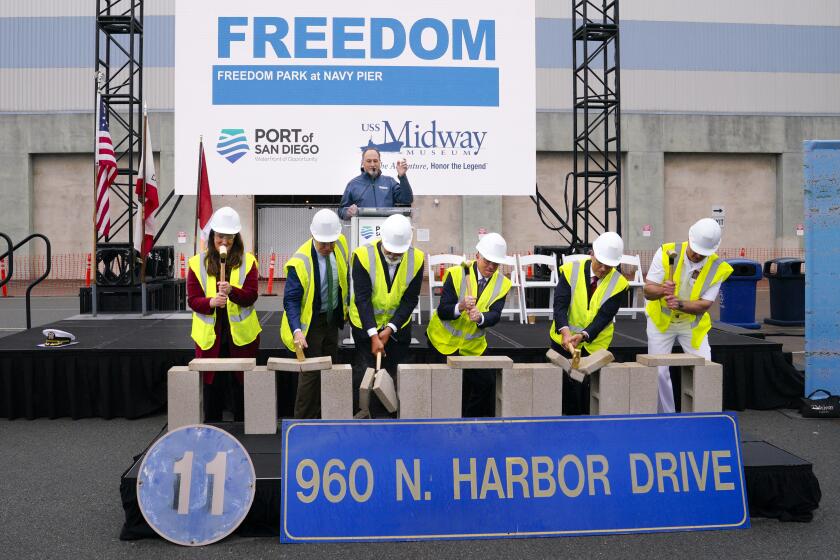 San Diego, CA - April 25: Officials during groundbreaking ceremony to kick off construction of Freedom Park at Navy Pier next to the USS Midway Museum on Thursday, April 25, 2024 in San Diego, CA. This multi-year joint project between Midway and the Port of San Diego will construct the largest veterans park on the West Coast. Rep Scott Peters (2nd from left), Terry Kraft (4th from left) and Mayor Todd Gloria (5th from left) were among the officials taking part. (Nelvin C. Cepeda / The San Diego Union-Tribune)