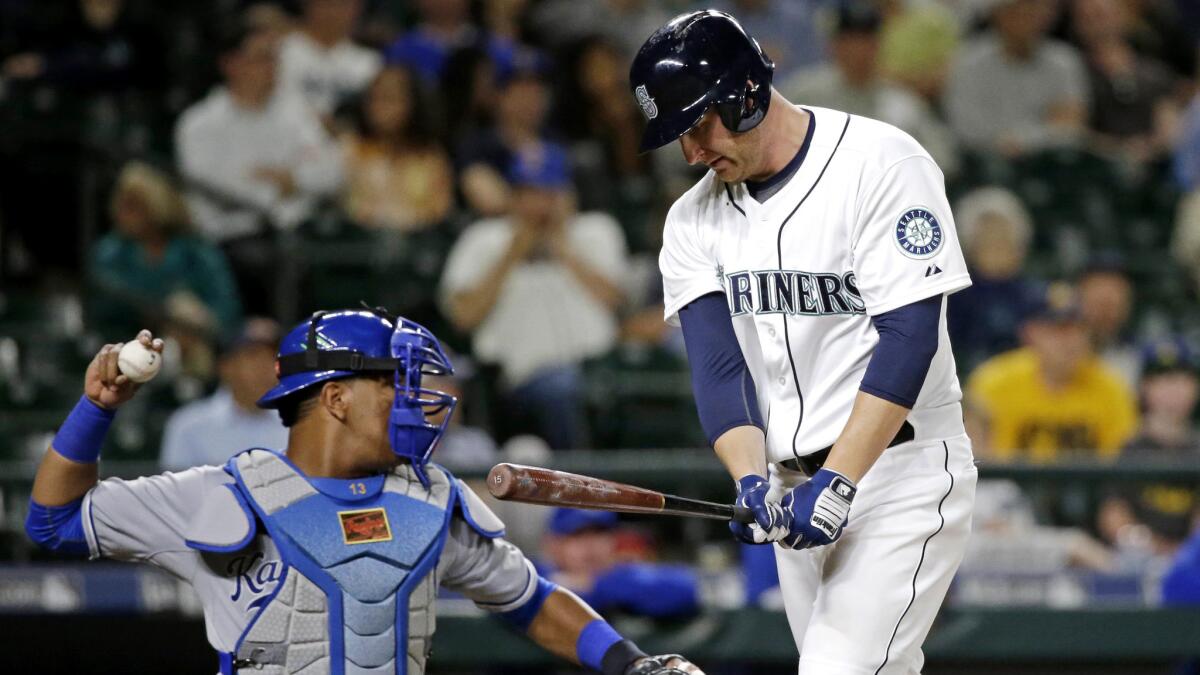 Mariners outfielder Mark Trumbo heads to the dugout after striking out against the Royals in a game June 24.