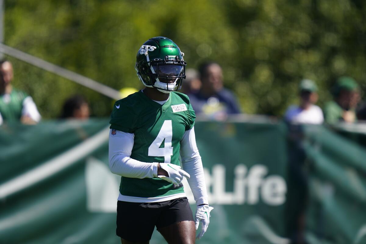 FILE - New York Jets' D.J. Reed takes part in drills at the NFL football team's practice facility, July 30, 2022, in Florham Park, N.J. The New York Jets cornerback learned his father had died Sunday, Sept. 11, 2022, morning after an 18-year battle with multiple sclerosis, and he is dedicating this season to him. (AP Photo/Frank Franklin II, File)