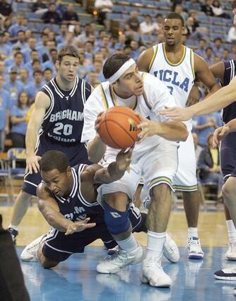 UCLA's Lorenzo Mata fights for a rebound against the Brigham Young in both teams' season opener at Pauley Pavilion.