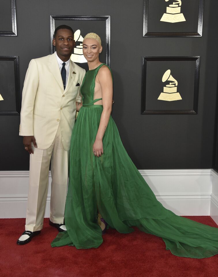Leon Bridges, left, and Brittni Jessie arrive at the 59th Grammy Awards.