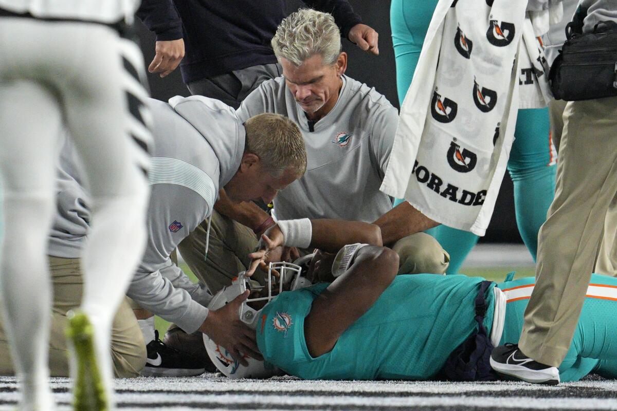 Miami Dolphins quarterback Tua Tagovailoa is examined after he was injured against the Cincinnati Bengals on Sept. 29, 2022.