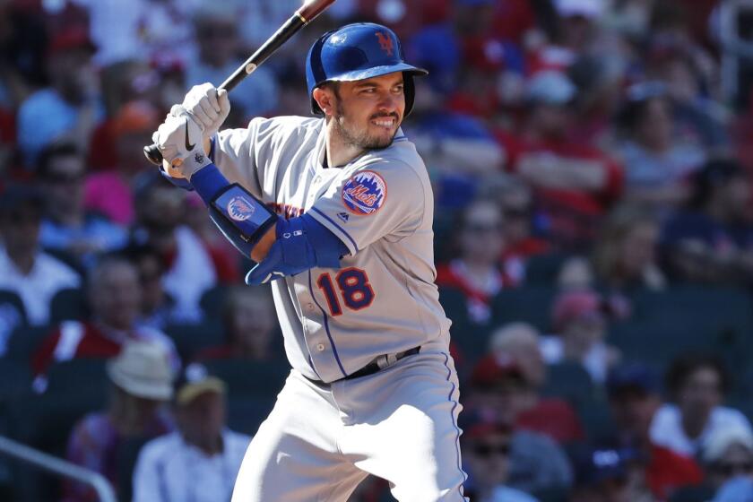 New York Mets' Travis d'Arnaud bats during the eighth inning of a baseball game against the St. Louis Cardinals Sunday, April 21, 2019, in St. Louis. (AP Photo/Jeff Roberson)