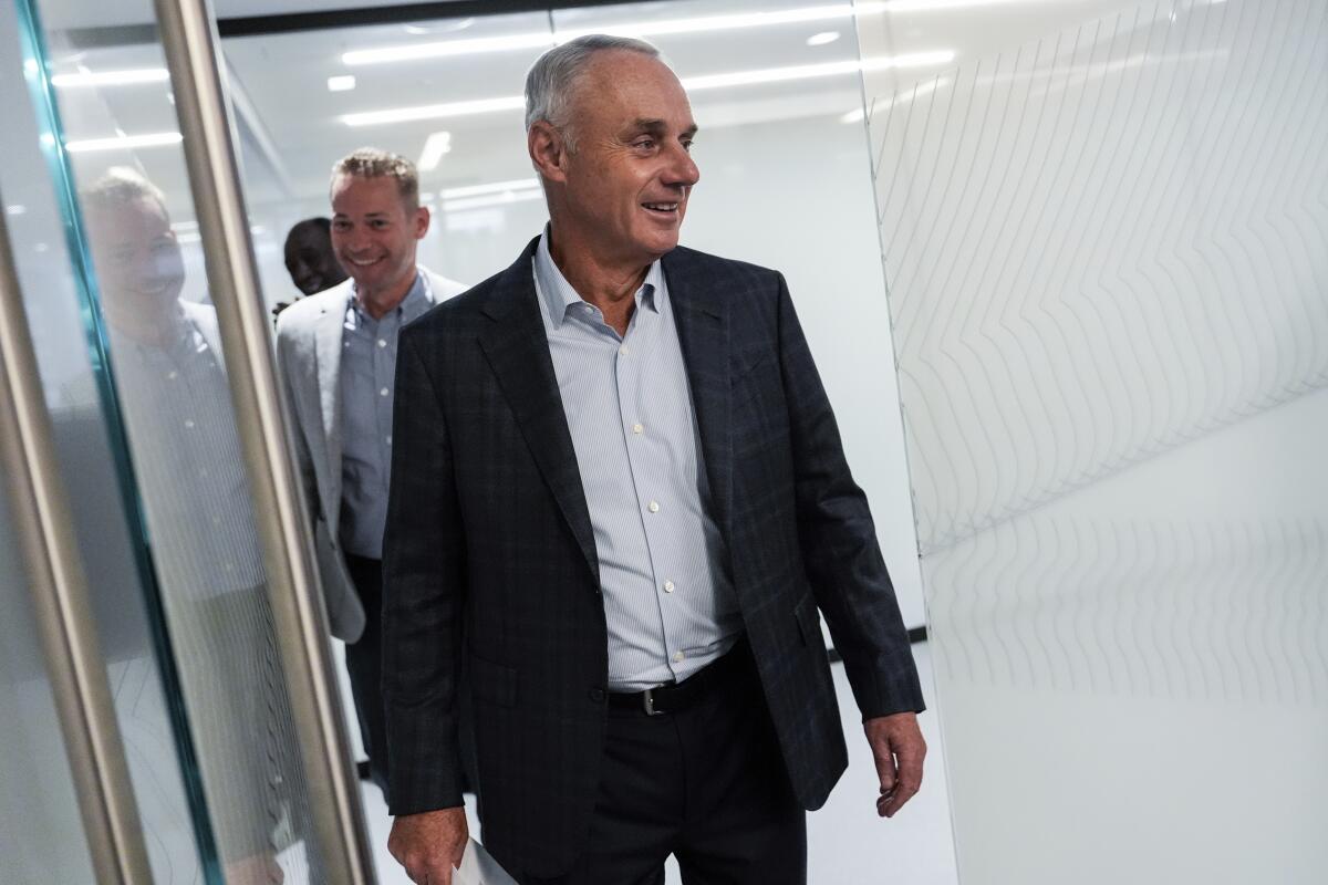 Major League Baseball commissioner Rob Manfred arrives at a press conference following an owners meeting.