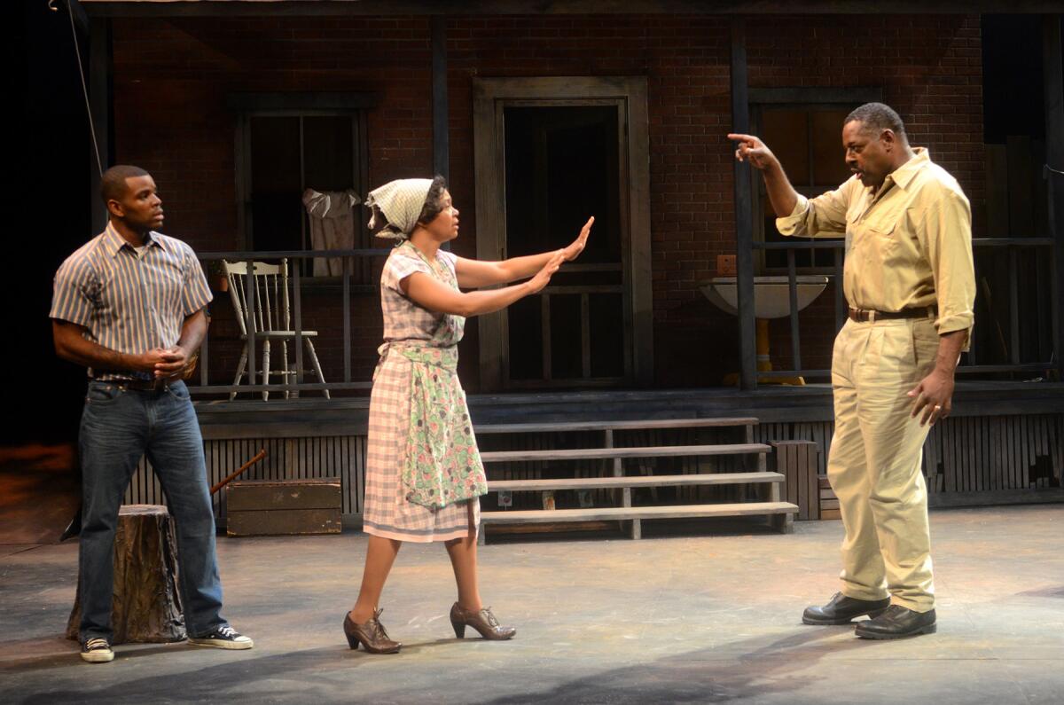 Jermelle Simon, left, Karole Foreman and Michael A. Shepperd in "Fences" at International City Theatre.