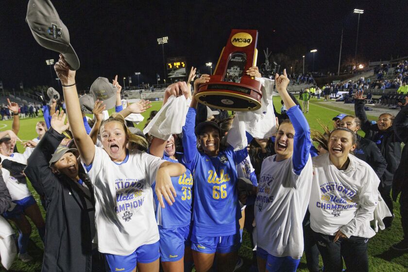 UCLA players celebrates after defeating North Carolina to win the NCAA women's soccer tournament final in Cary, N.C., Monday, Dec. 5, 2022. (AP Photo/Ben McKeown)