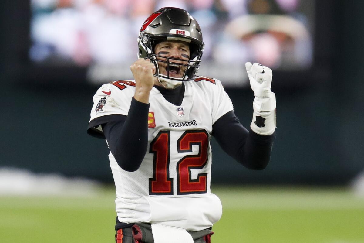 Tampa Bay Buccaneers quarterback Tom Brady reacts after winning the NFC championship NFL football game.