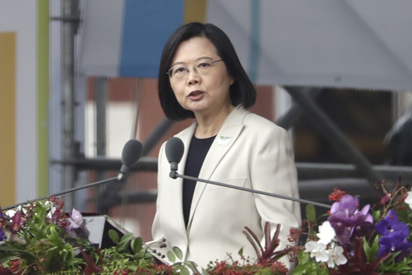 FILE - Taiwanese President Tsai Ing-wen delivers a speech during National Day celebrations in front of the Presidential Building in Taipei, Taiwan, Monday, Oct. 10, 2022. Tsai recently told Pope Francis in a letter that war with China is “not an option” and said constructive interaction with Beijing, which claims the island as part of its territory, depends on respecting self-ruled Taiwan's democracy.(AP Photo/Chiang Ying-ying, File)