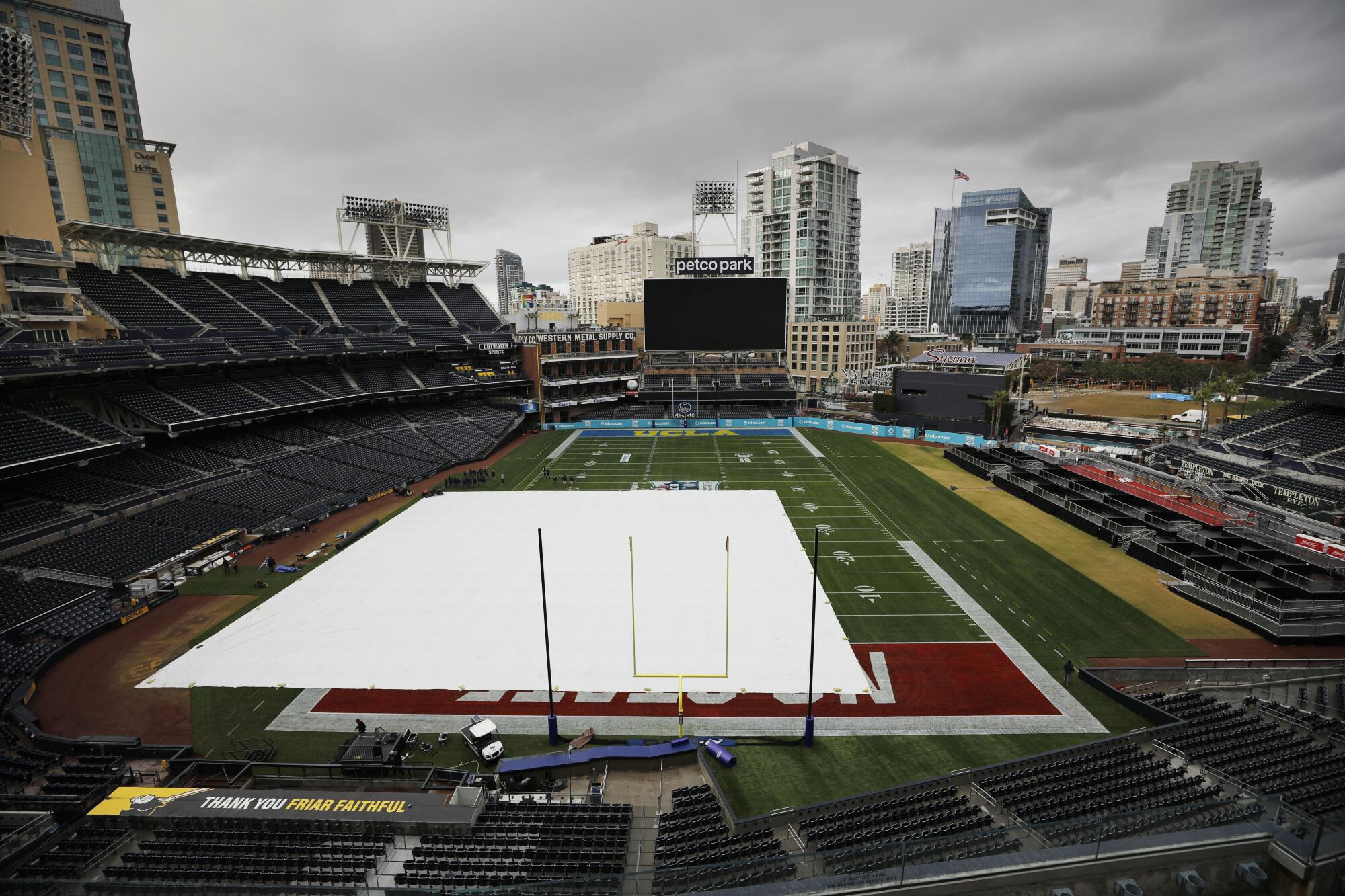 A few hours after the Holiday Bowl was cancelled, signage and team benches were removed and the field