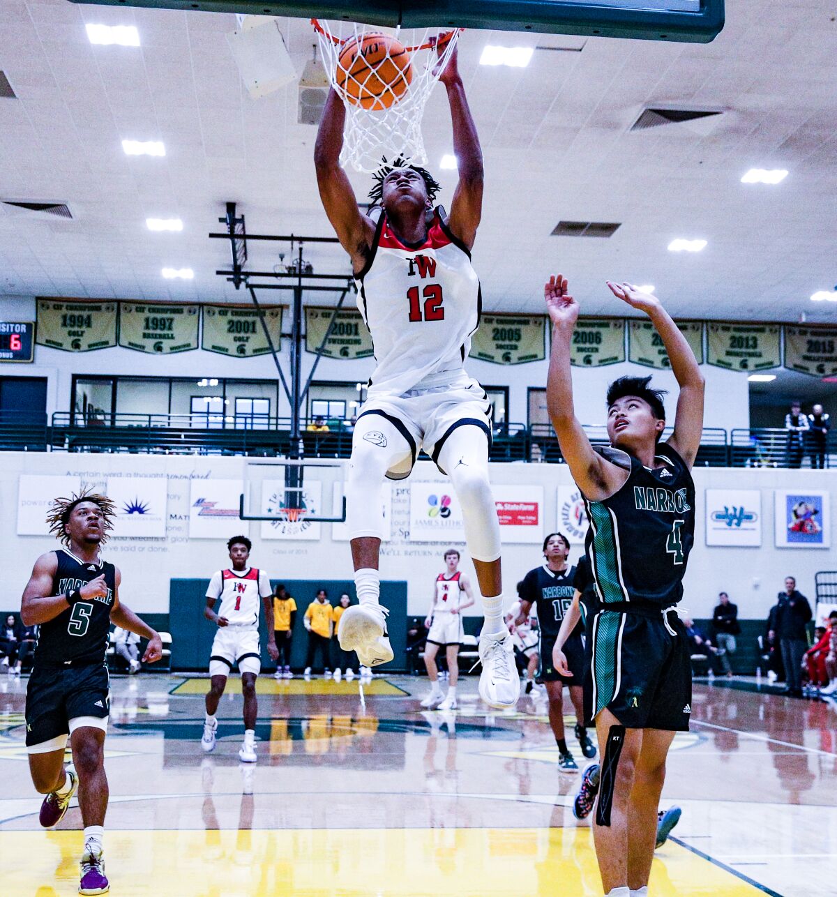 Harvard-Westlake's Jacob Huggins with one of his many dunks against Narbonne.