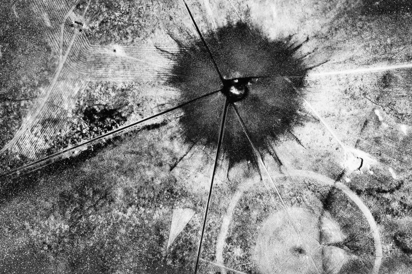 FILE - This photo shows an aerial view after the first atomic explosion at Trinity Test Site, in N.M., on July 16, 1945. A new film on J. Robert Oppenheimer's life and his role in the development of the atomic bomb as part of the Manhattan Project during World War II opens in theaters on Friday, July 21, 2023. On the sidelines will be a community downwind from the testing site in the southern New Mexico desert, the impacts of which the U.S. government never has fully acknowledged. (AP Photo, File)