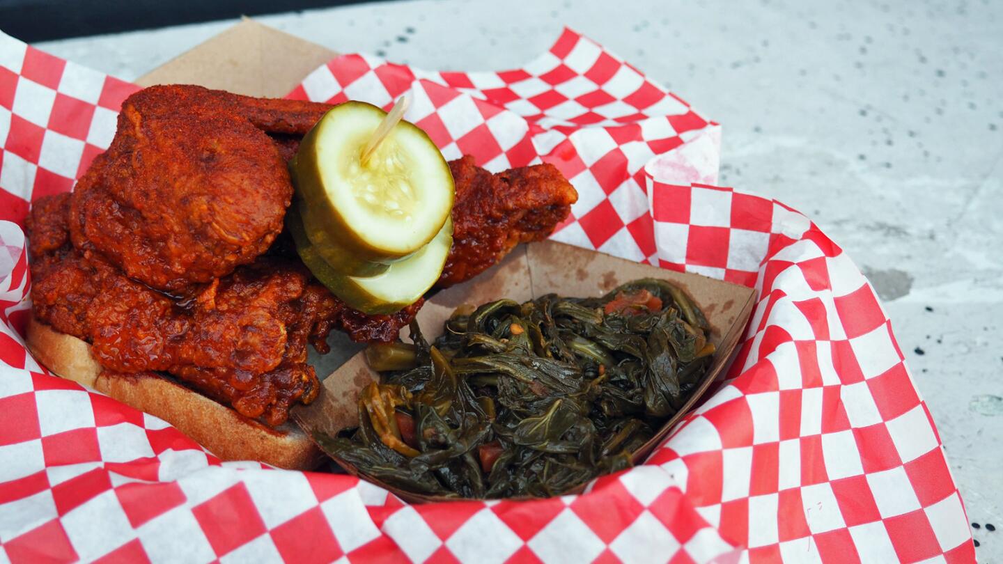 The Howlin' Ray's medium hot chicken and a side of collard greens.