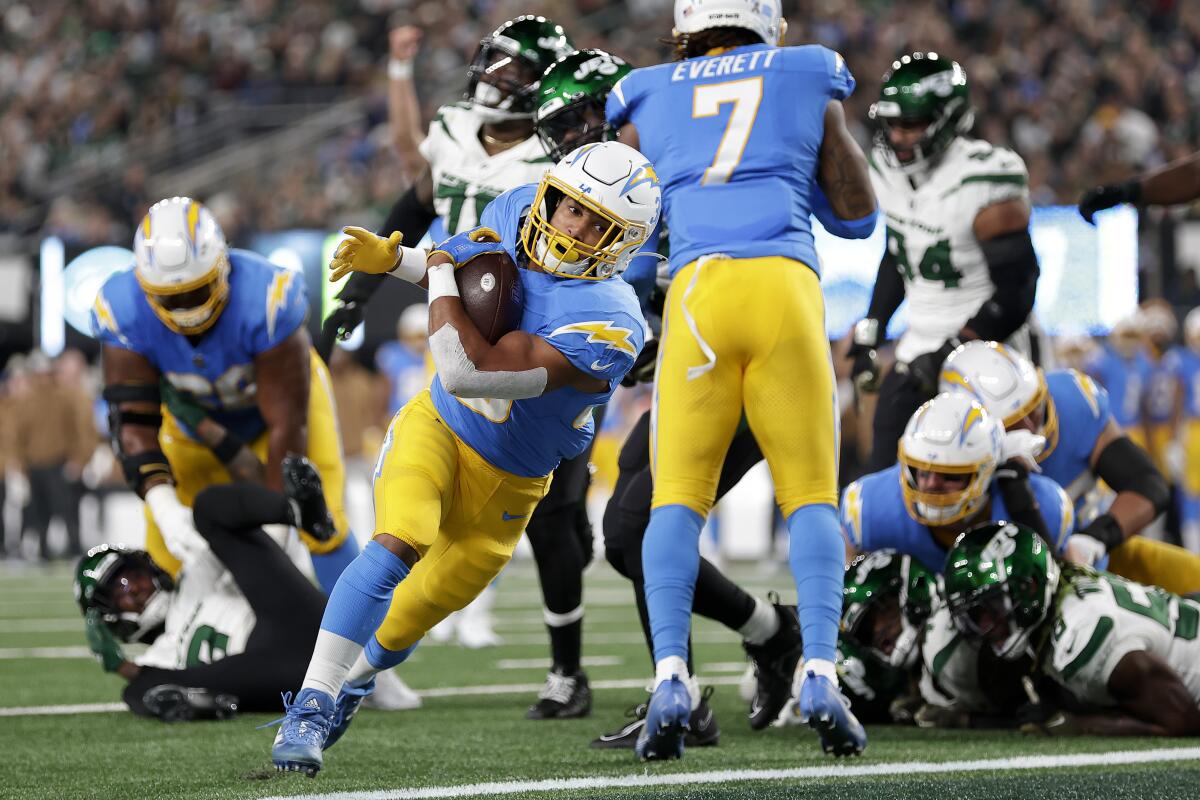  Chargers running back Austin Ekeler (30) crosses the goal line for a touchdown against the New York Jets.