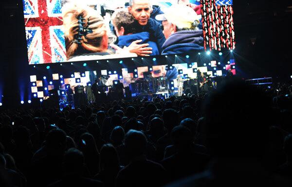 A video of President Barack Obama with victims of Superstorm Sandy plays in Madison Square Garden as The Who perform on Wednesday.