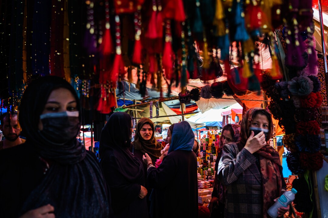  Women shop in the women's area of the Lycee Maryam Bazaar.