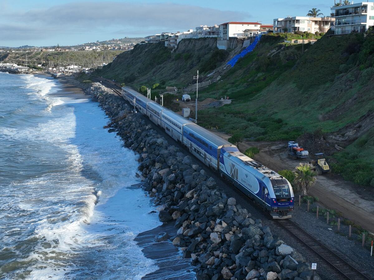 An aerial view of Amtrak Pacific Surfliner resuming service while passing by landslides in San Clemente in March.