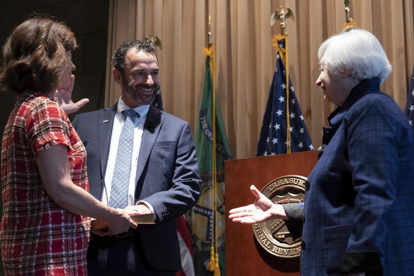 Treasury Secretary Janet Yellen congratulates new IRS commissioner Danny Werfel after the swearing-in at the IRS headquarters in Washington, Tuesday, April 4, 2023. (AP Photo/Jose Luis Magana)