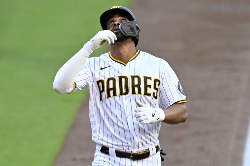 San Diego Padres' Xander Bogaerts reacts at the plate after hitting a two-run home run against the Colorado Rockies during the first inning of a baseball game in San Diego, Saturday, April 1, 2023. (AP Photo/Alex Gallardo)