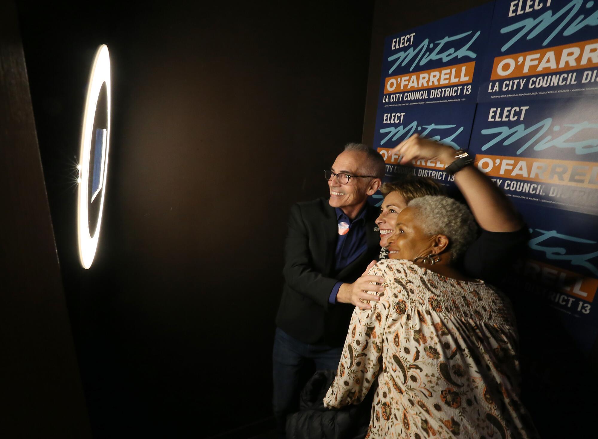 Los Angeles City Councilman Mitch OFarrell takes pictures with supporters