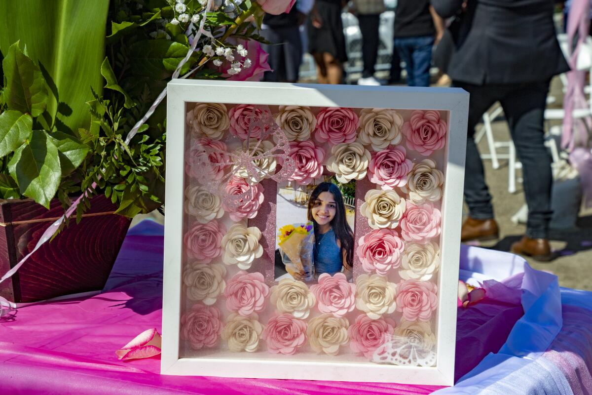 Family and friends paid tribute to Victoria Barrios with a flower-decorated portrait.