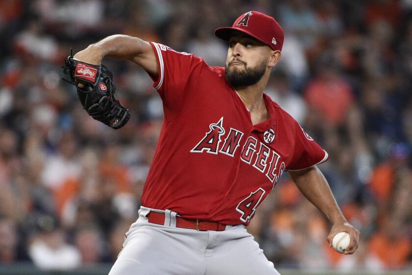 Los Angeles Angels starting pitcher Patrick Sandoval delivers during the first inning of a baseball game against the Houston Astros, Saturday, Sept. 21, 2019, in Houston. (AP Photo/Eric Christian Smith)