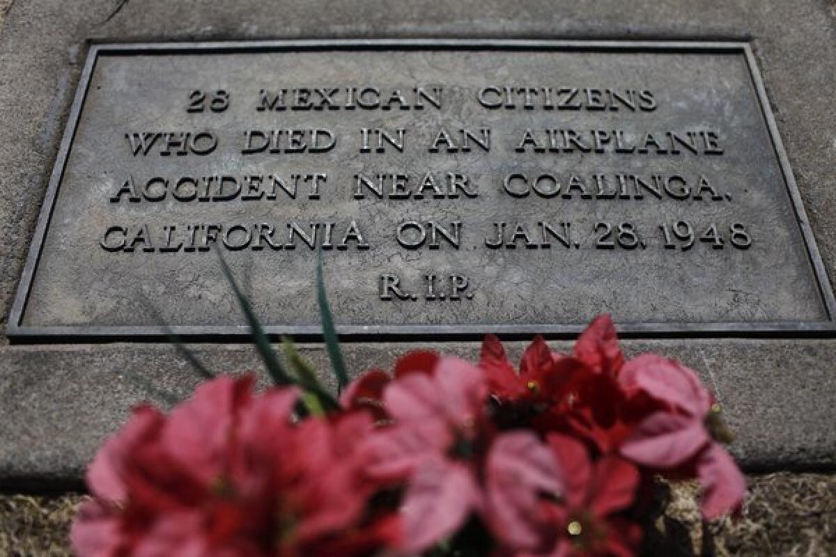 A grave marker: "28 Mexican citizens who died in an airplane accident near Coalinga, California on Jan. 28, 1948. R.I.P" 