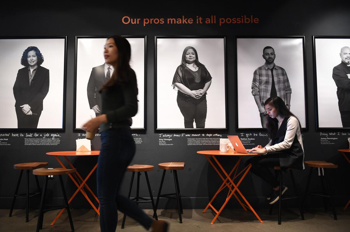 Prachi Pundeer, right, a product designer, works at Thumbtack's office in San Francisco.