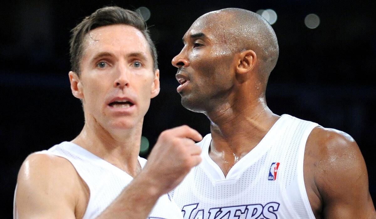 Steve Nash and Kobe Bryant confer during a game against the Knicks in New York on Dec. 25, 2012.