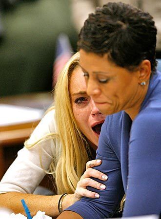 Actress Lindsay Lohan and lawyer Shawn Chapman Holley attend a probation revocation hearing at the Beverly Hills Courthouse. Lohan was found in violation of her probation for the August 2007 no-contest plea to drug and alcohol charges stemming from two separate traffic accidents. She is scheduled to surrender on July 20 to serve her 90 day jail sentence.