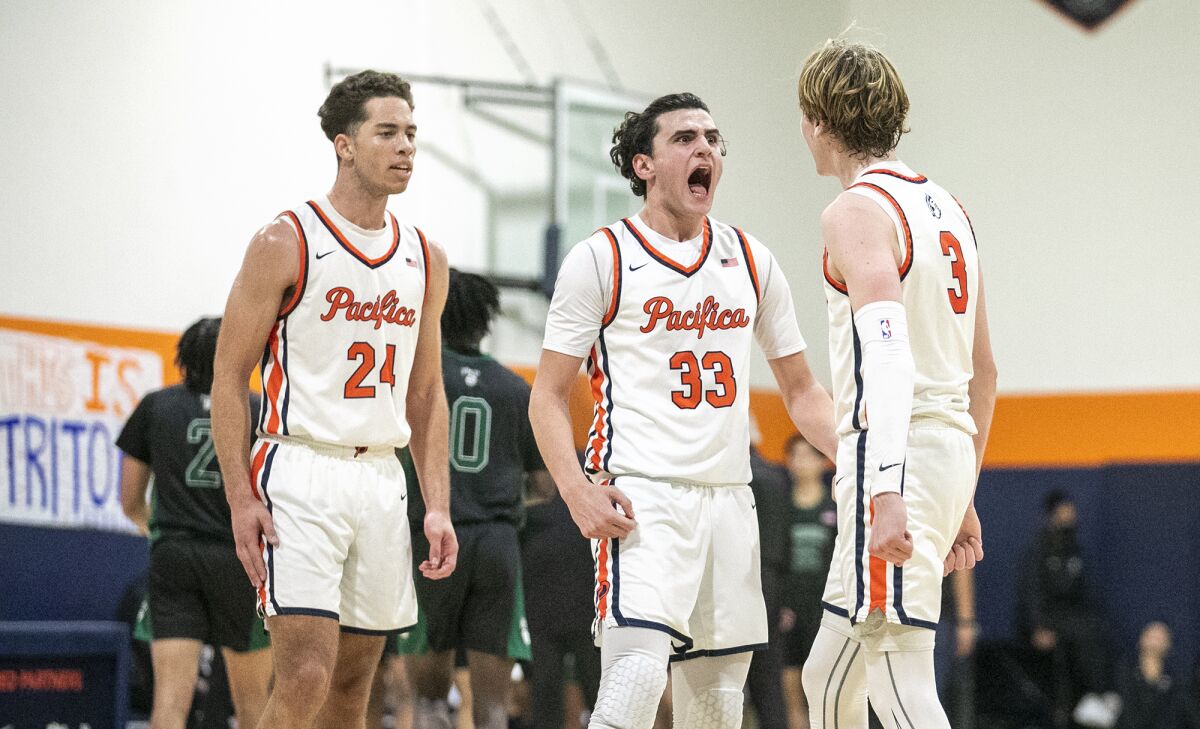 Pacifica Christian's Alex Stewart, left, Salim Semaan, center, and Parker Strauss celebrates against Fairmont Prep.