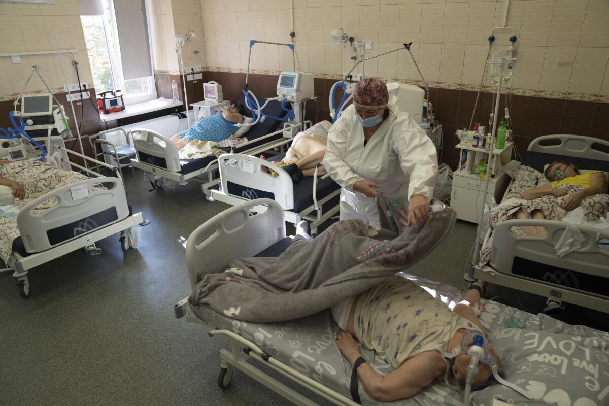 COVID-19 patient lying in a hospital bed in Ukraine
