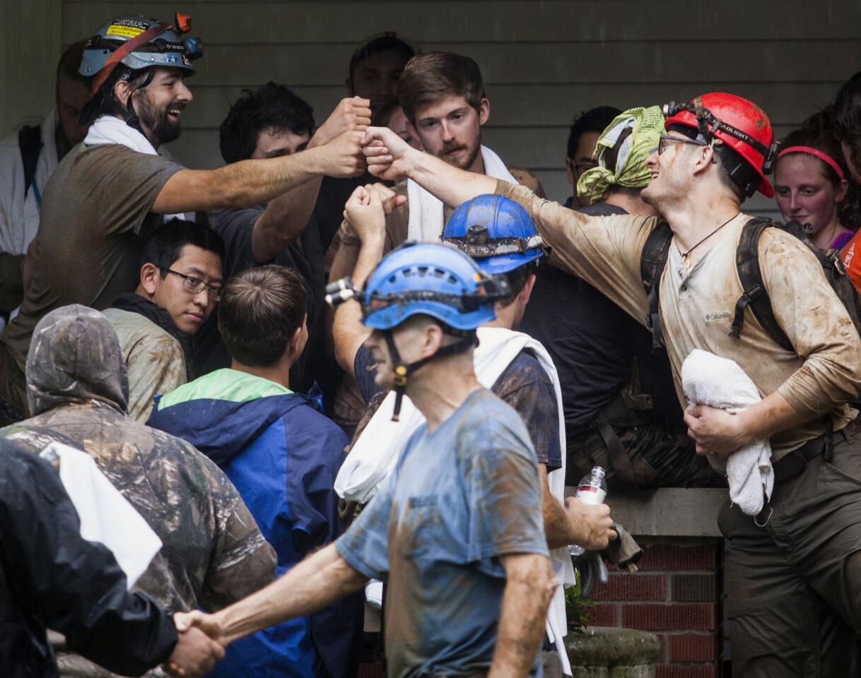 People who were rescued from Hidden River Cave celebrate on May 26, 2106. A group trapped by flash flooding on a field trip to the Kentucky cave Thursday walked through neck-deep water to get to safety, authorities said.