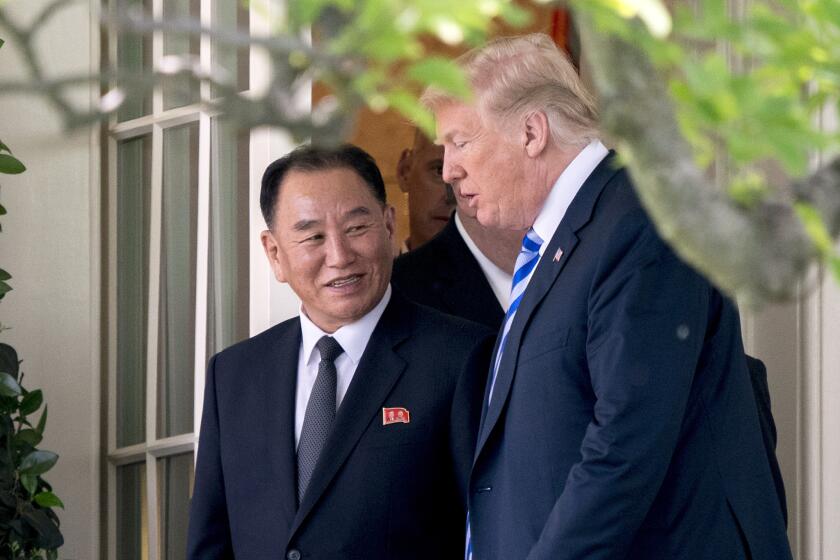 President Donald Trump talks with Kim Yong Chol, former North Korean military intelligence chief and one of leader Kim Jong Un's closest aides, as they walk from their meeting in the Oval Office of the White House in Washington, Friday, June 1, 2018. (AP Photo/Andrew Harnik)
