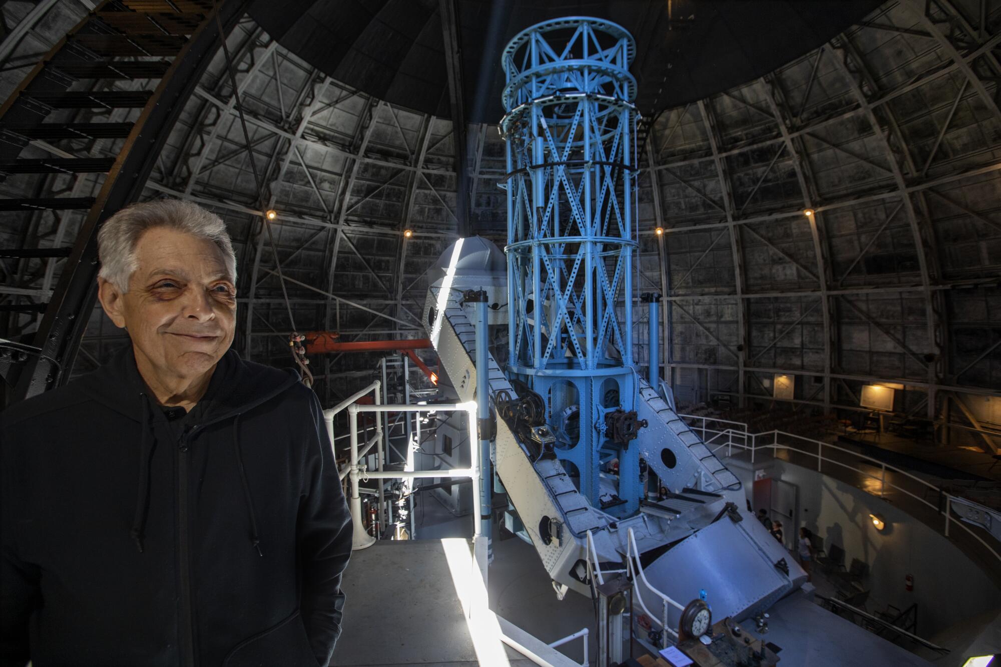 Tom Meneghini, executive director of the Mt. Wilson Institute, at the 100-inch telescope. 