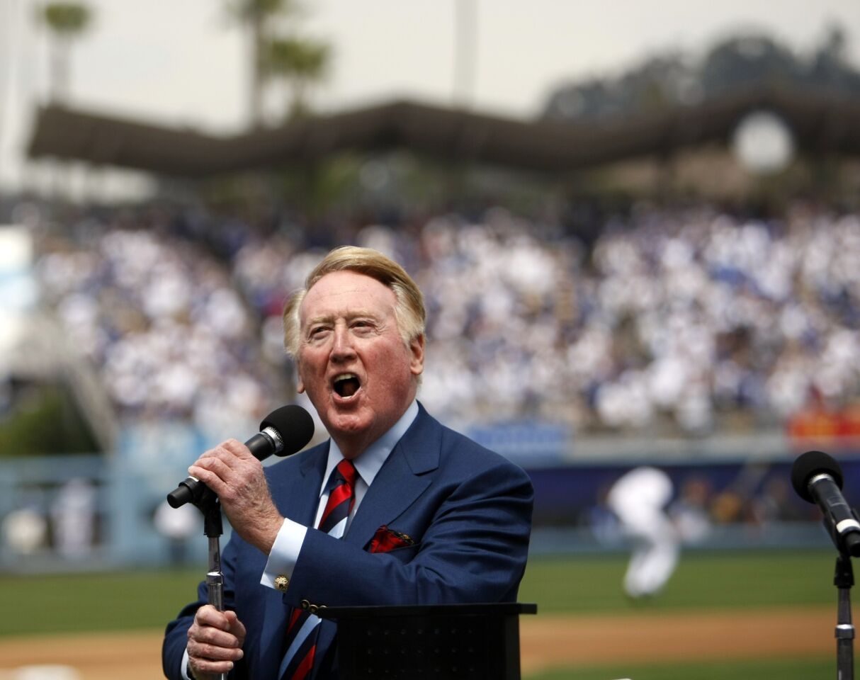 Vin Scully announces, "It's time for Dodgers baseball," before the team's season opener against the San Francisco Giants in April 2009.