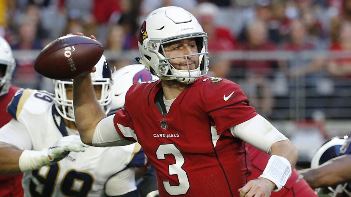 Cardinals quarterback Josh Rosen looks to throw against the Rams on Dec. 23.