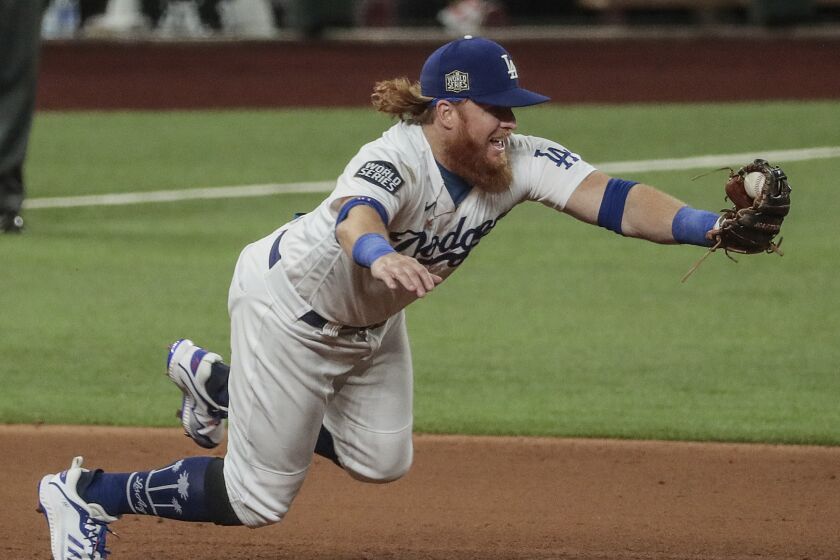 Dodgers third baseman Justin Turner snags a ground ball during Game 1 of the World Series on Oct. 20, 2020.