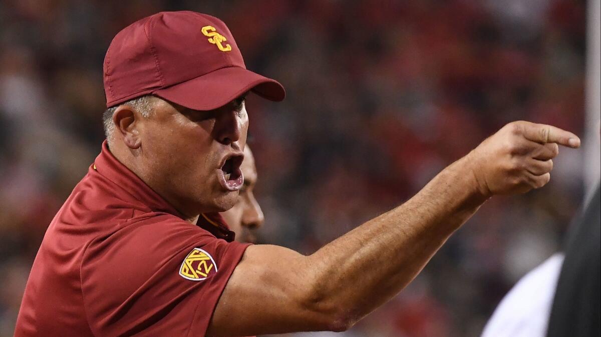 USC head coach Clay Helton yells from the sidelines during the game against the Arizona at Arizona Stadium on Saturday in Tucson, Ariz.