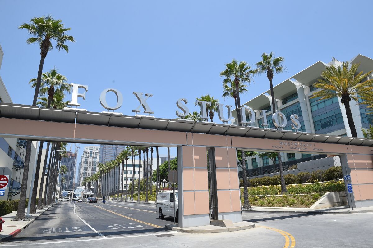 The words "Fox Studios" appears on an arch above a road.