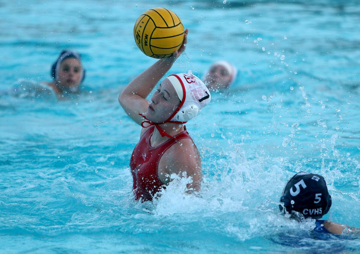 Burroughs High water polo player Nancy Baylor takes a shot on goal in the Pacific League Tournament semifinal vs. Crescenta Valley High, at Arcadia High in Arcadia on Tuesday, Feb. 4, 2020. Burroughs won 10-3.